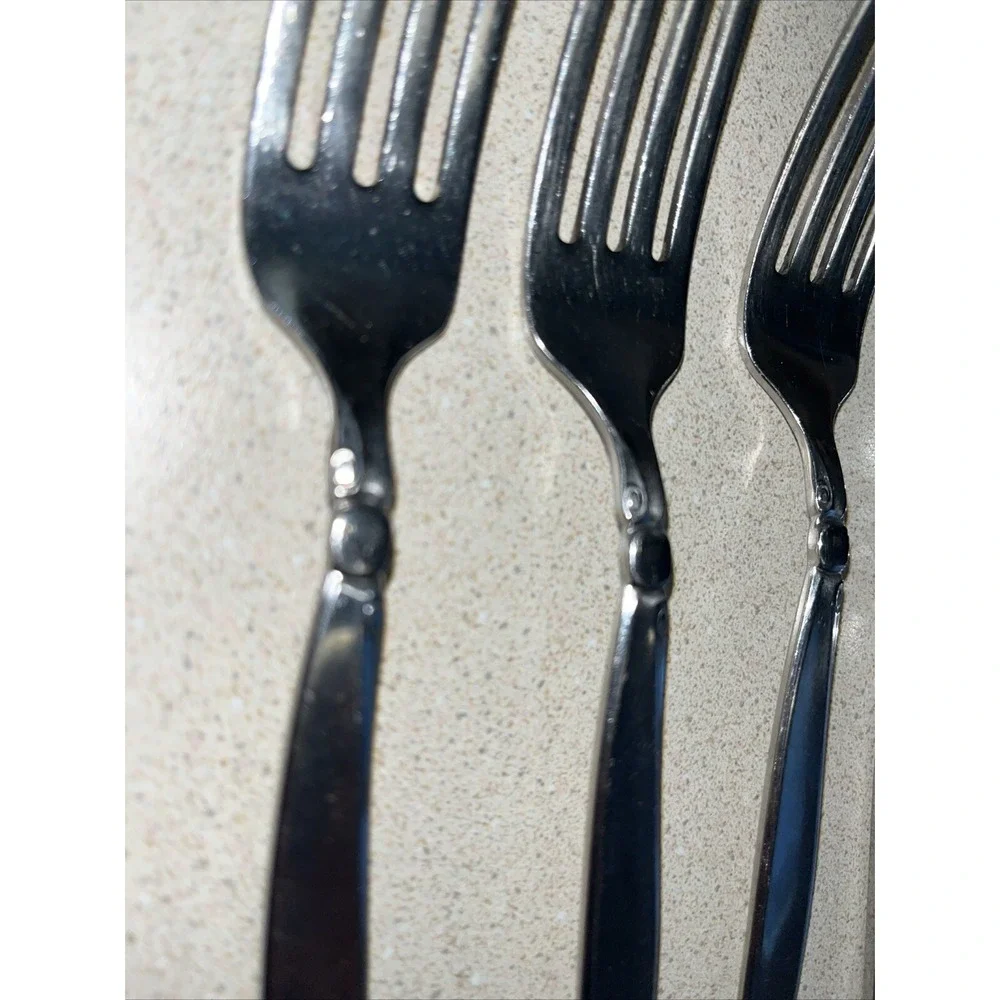 9 Piece Set ONEIDACRAFT PREMIER STAINLESS SHORELINE 3 Forks, 1 Knife & 5 Spoons.